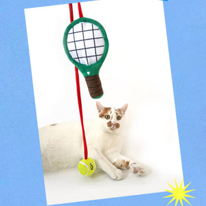 Self-play tennis racket cat toy with a long bouncy spring. Made with soft plush materials to keep your cat safe during active play.