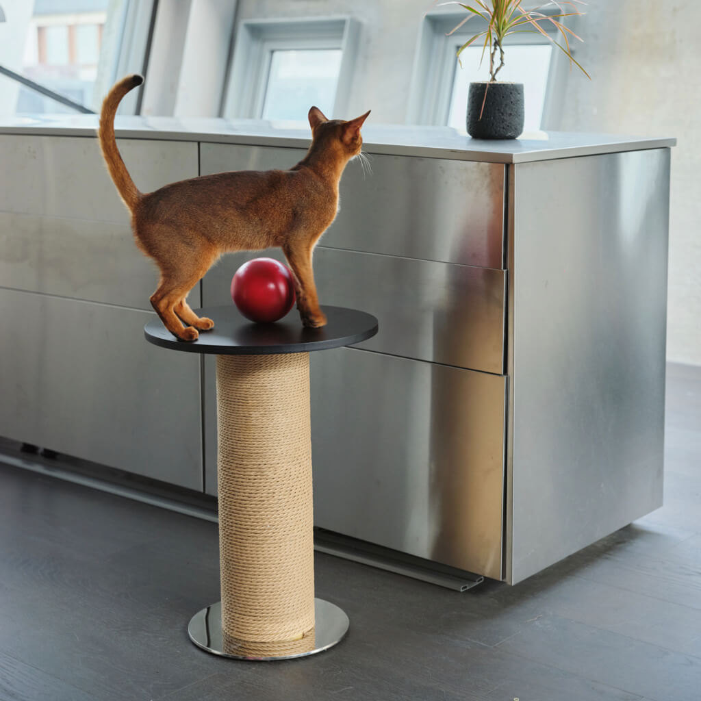 Red decorative sphere on top of the Mid-Century Modern Cat Scratching Post and Side Table, in the moder and industrial style home.