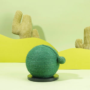 Green Castus Ball Sisal Cat Scratcher with decorative cactus props in the background.