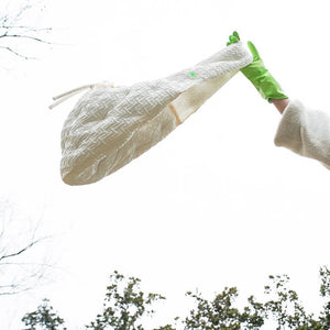 Crossbody Pet Travel Bag lifted in the air, illustrating its lightweight and portable nature.