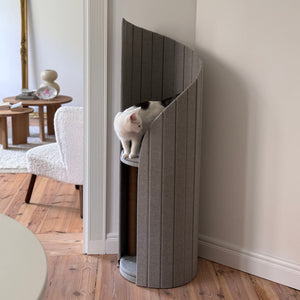 Close-up of a cat lounging on the soft, comfortable shelf of the Time Travel Cat Tower - Light Grey.