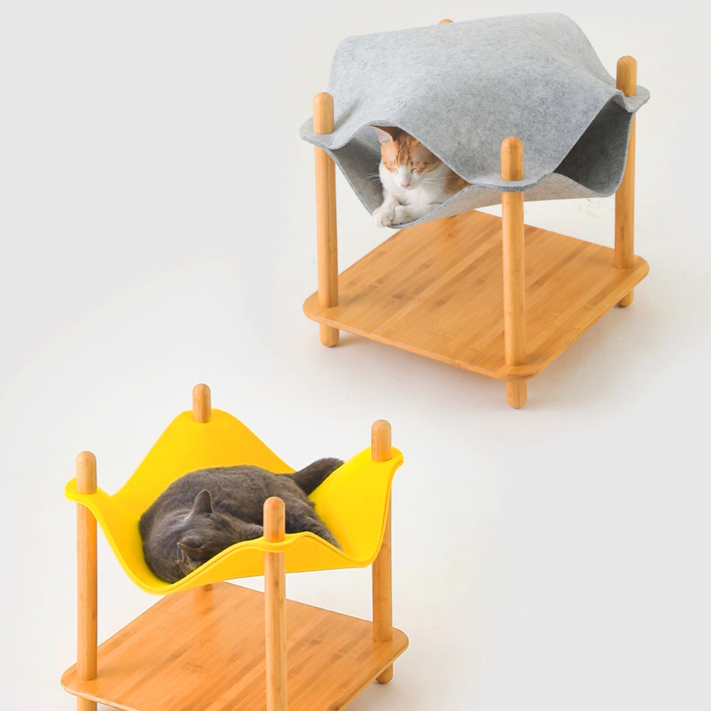 Two cats resting in separate felt layers, one in a gray felt hammock and another in a yellow felt bed, both supported by the bamboo side table, demonstrating a multi-level resting space.