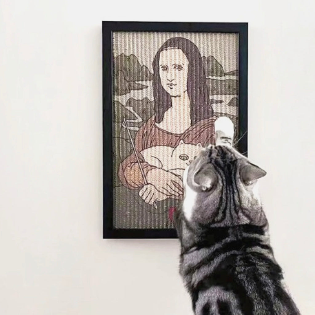 A cat scratching a framed Mona Lisa-inspired painting cat scratcher, reimagined with a playful cat twist, mounted on a modern white wall.